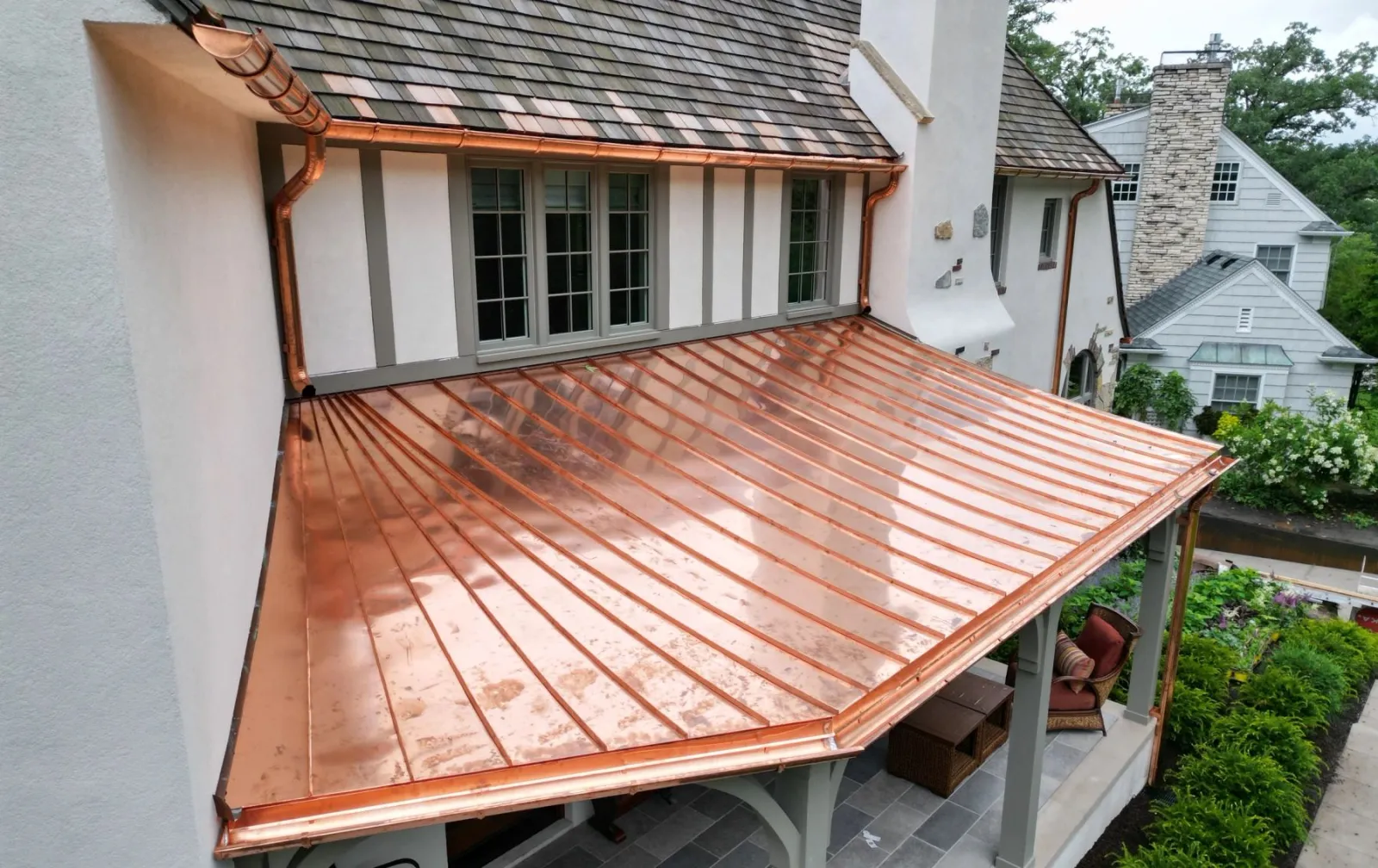 New copper standing-seam porch roof with copper gutters and downspouts